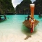 1502580-long-tail-boat-in-the-lagoon-1.jpg